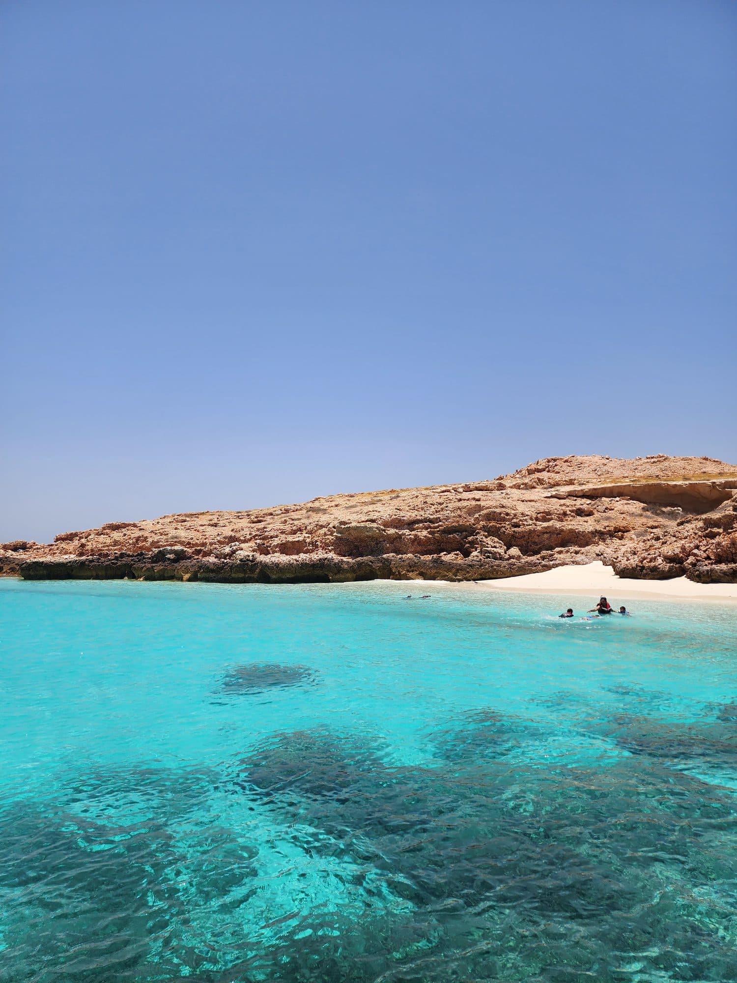 A sheltered turquoise cove at the Daymaniyat Islands